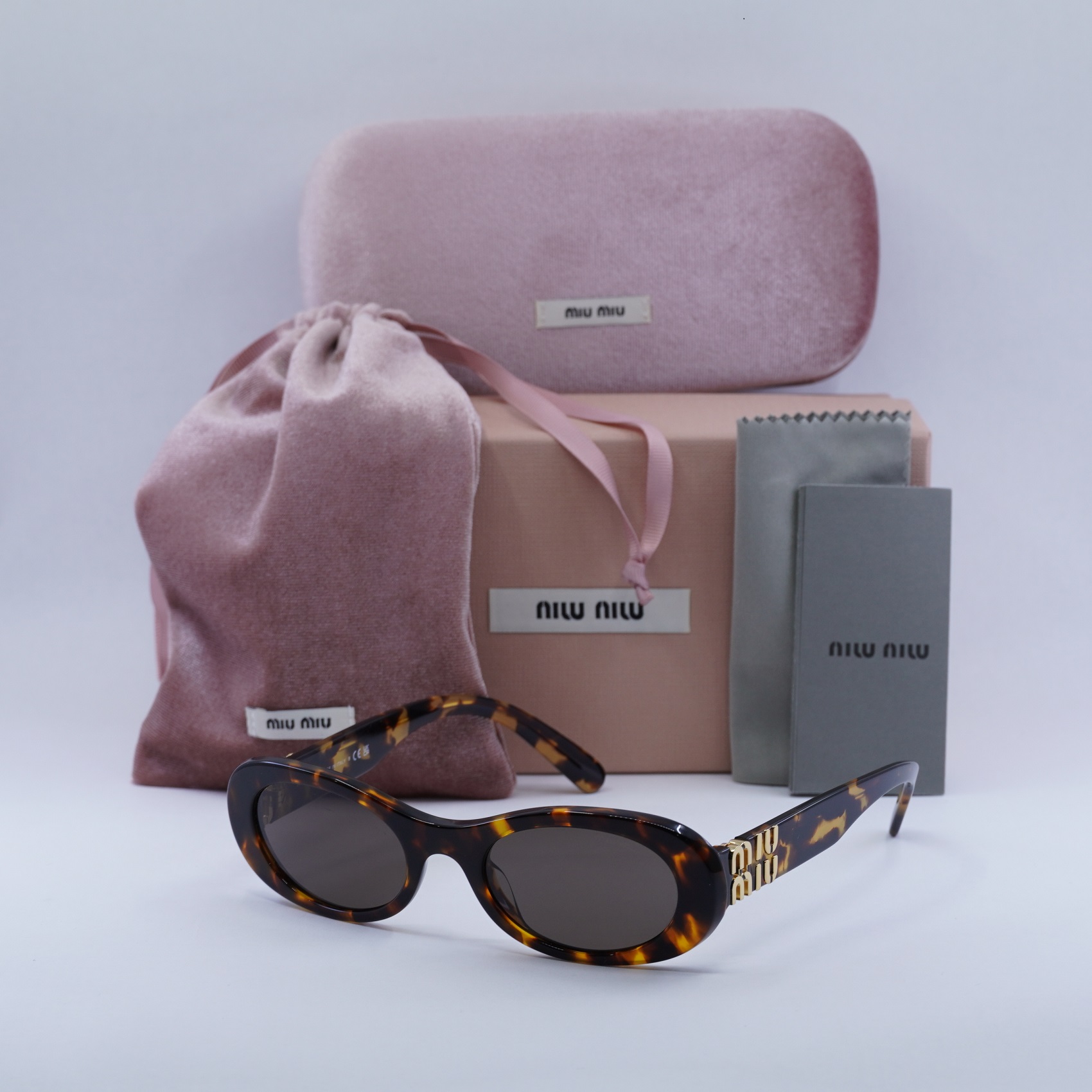 Miu Miu MU 03ZS Cat-Eye Sunglasses | EyeOns.com